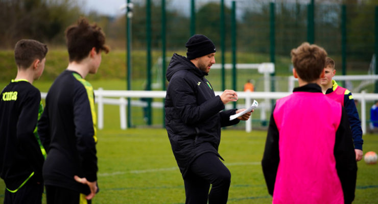 Coach speaks to players