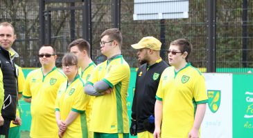 team in Norwich City kit
