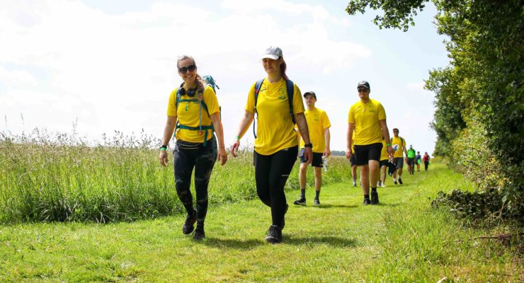 people walking in yellow tshirts