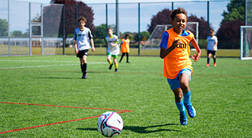 young boy with rugby ball