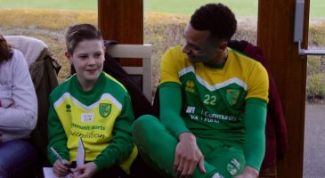 Jacob Murphy sits with one of the family members