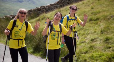 Walkers wave on route