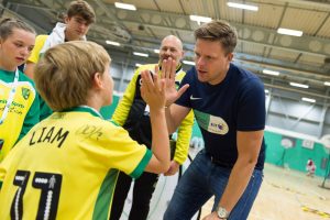 Jake Humphrey high fives a young player