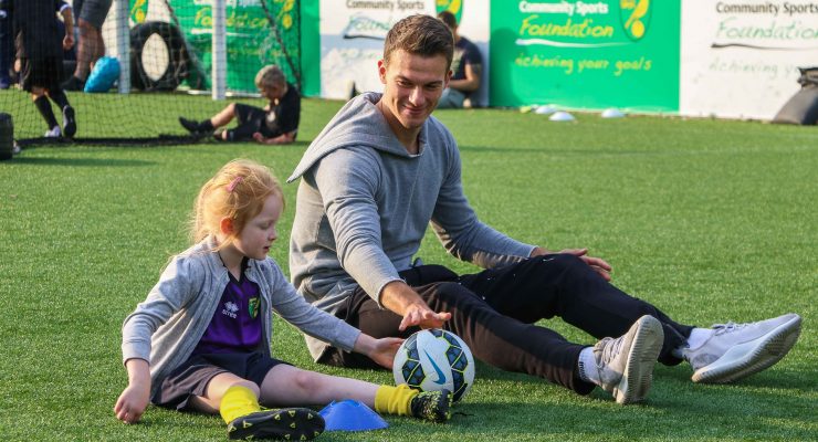 zimmermann sits with young girl