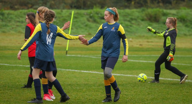 Cliff park player high fives team mates