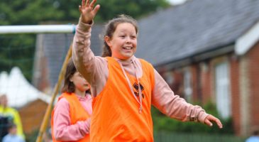 Young participant enjoys PE session at Kenninghall Primary