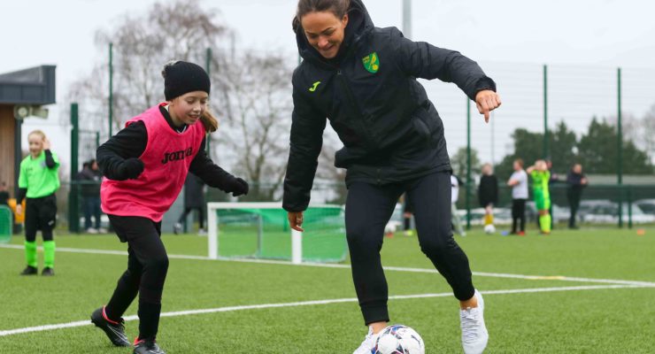 Jodie Drake Norwich City Women FC plays football with participant