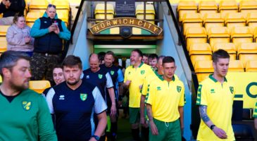 Fundraising Norwich fans grace the turf at Carrow Road