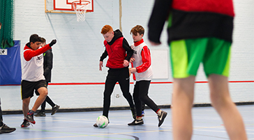 Young people playing football