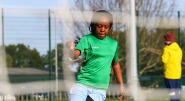 A girl plays football at a tournament at The Nest