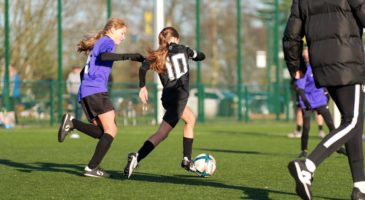 Girls playing football