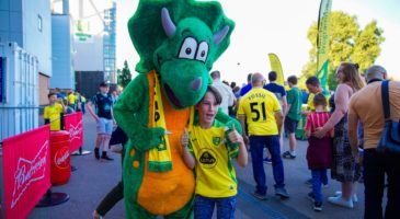 Posing with mascot