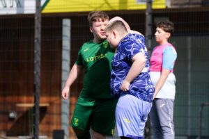 Two lads playing football