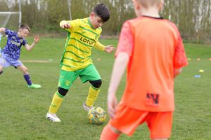 Child playing football