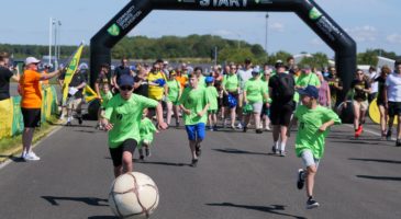 a crowd of people on a race track
