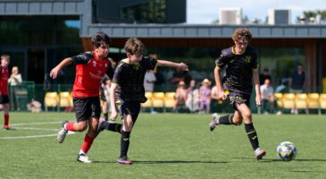 boys playing football on the pitch