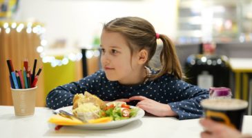 girl in cafe with jacket potato
