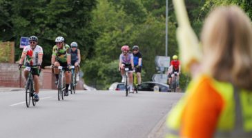group of people on bicycles on the road