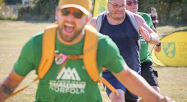 three men running towards the camera