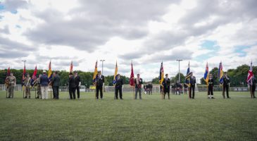 Military personnel with flags