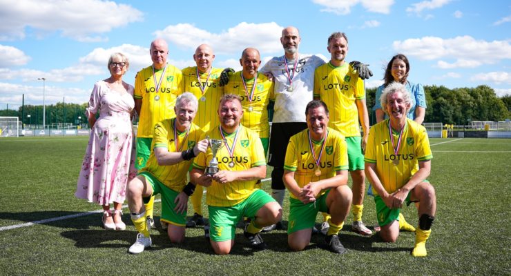 Football team with medals and trophy