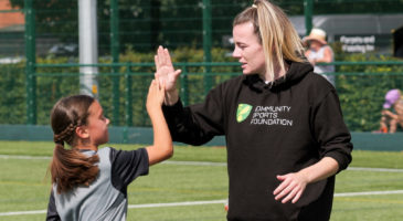 Lauren Hemp high fiving girl
