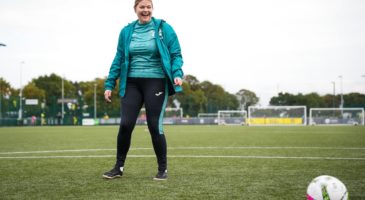 a women in sportswear on a football pitch