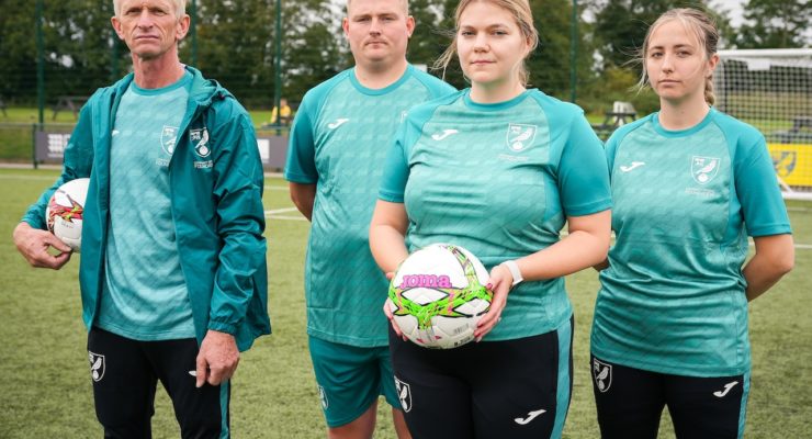 two men and two women in sportswear 