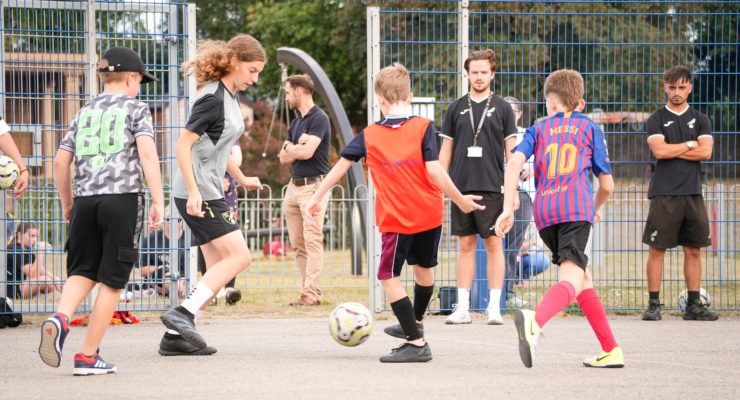 Playing football at a Kicks session in Mile Cross