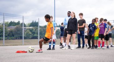 Participants lining up for crossbar challenge