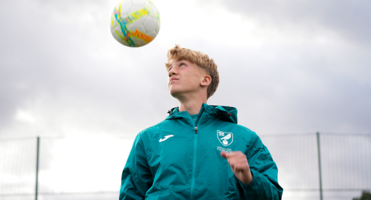 Boy heading a football