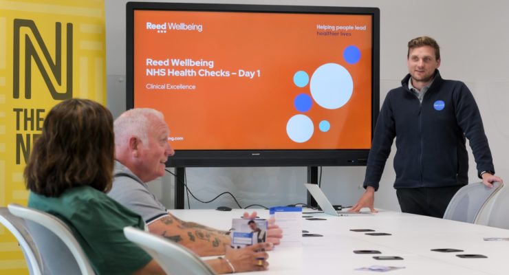 man presenting to two people