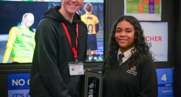 Freya Symonds receiving her award from a Cliff Park Ormiston Academy pupil