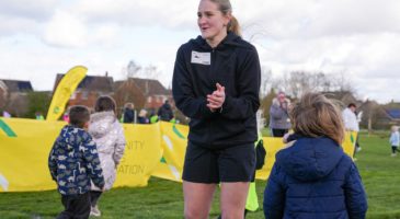 woman standing clapping 