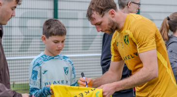 Norwich player signing shirt