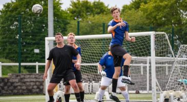 men playing football action shot
