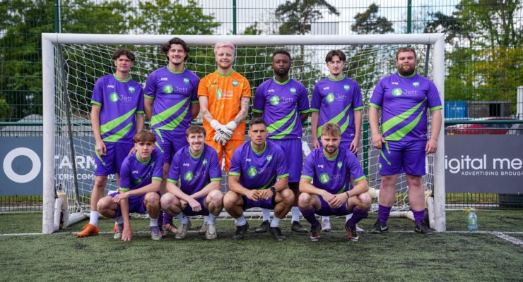 jett distribution team photo in front of a goal
