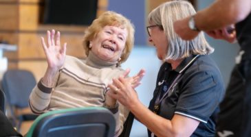 A volunteer and participant at Duncan's Club dementia session