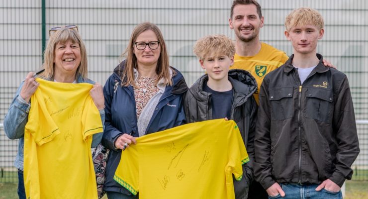 four norwich city fans with kenny mclean