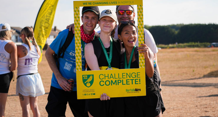 Group of people posing being a challenge complete sign