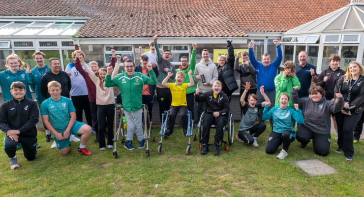 Group of people with their hands in the air